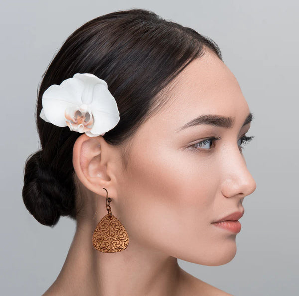 Female Model with Flower In Her Hair Wearing Damask Trillion Copper Drop Earrings