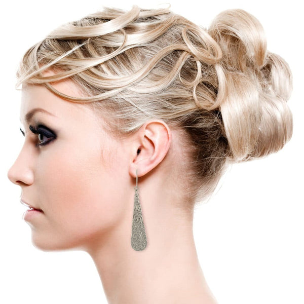 Female Model Wearing Damask Embossed Long Aluminum Teardrop Earrings