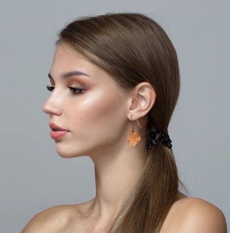 Attractive Female Model Wearing Damask Embossed Quatrefoil Earrings
