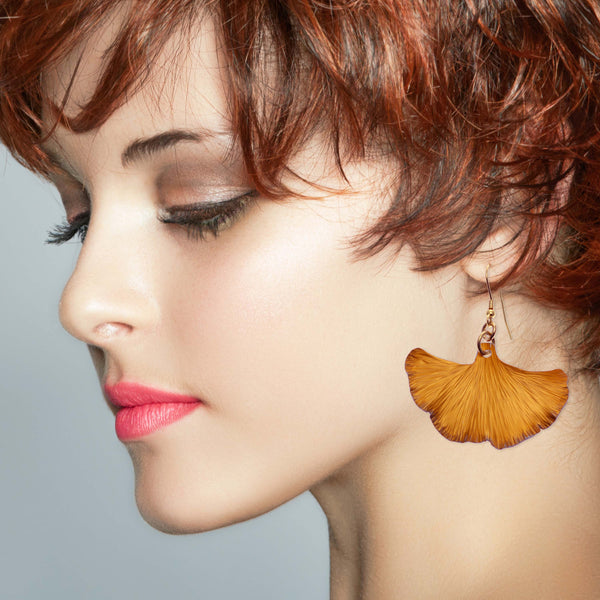 Female Model Wearing Medium Ginkgo Leaf Anodized Aluminum Orange Earrings