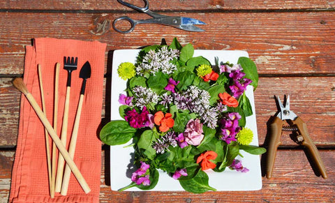 floral salad on table with tools