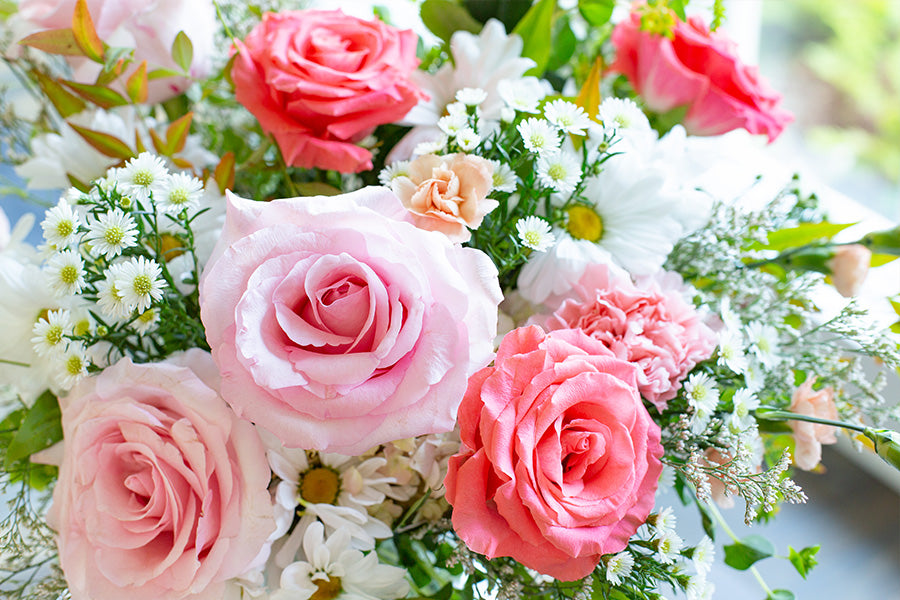 A close up view of a bouquet of pink roses