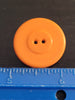 back of orange Hobart colt button