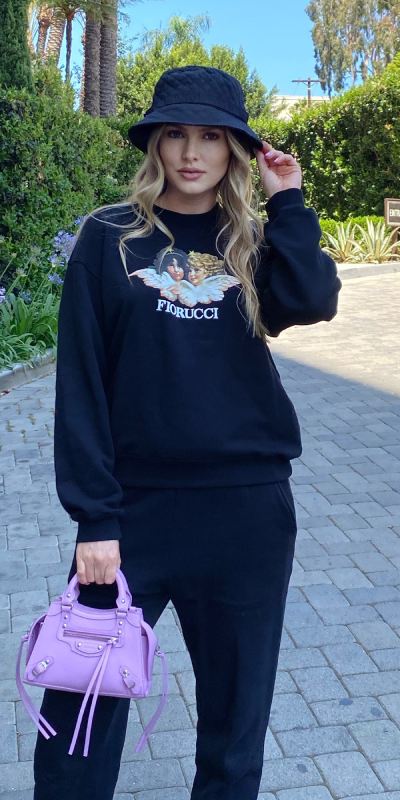 Hailey Bieber looks bold in black and wears Balenciaga baseball cap for  pilates session  Daily Mail Online
