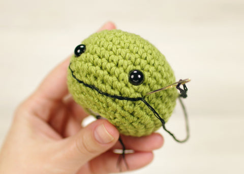 Free amigurumi tutorial - Embroidering a smiling mouth