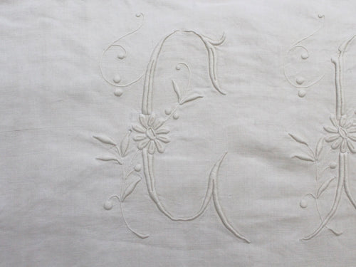 A rare antique monogram 'VC' with crown on linen bolster by 