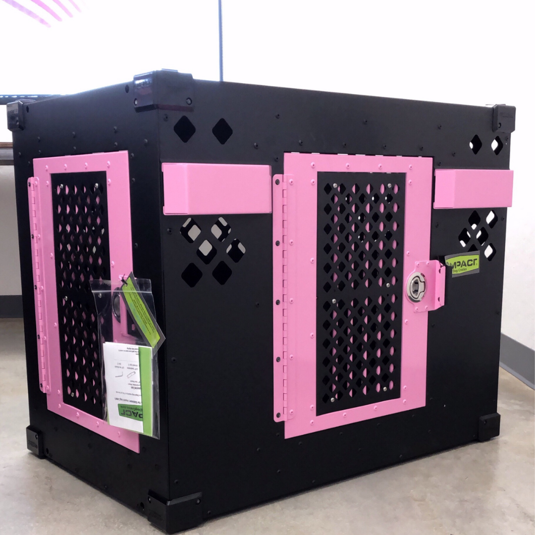 black and pink stationary side door crate