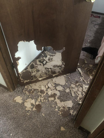 wood door in home chewed to pieces by dog escaped wire crate