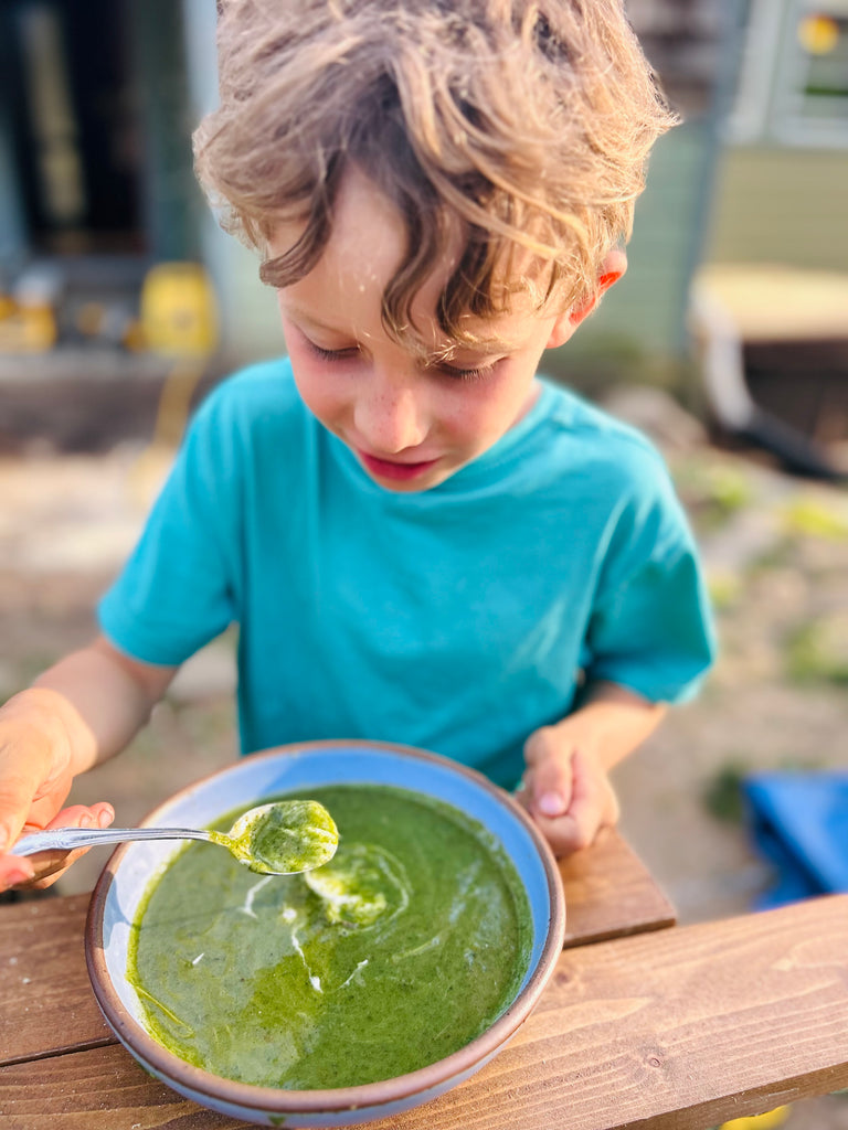Child Eating Stinging Nettle Soup