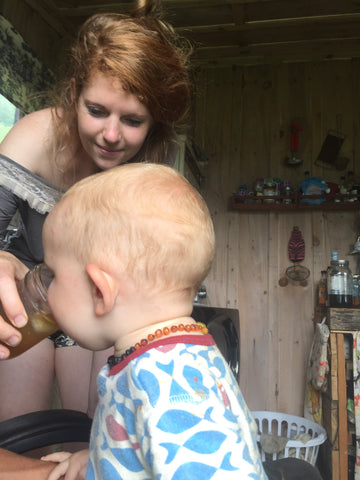 Baby drinking reishi lemonade