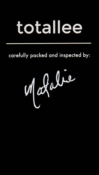 Black warranty card signed by totallee staff member Natalie
