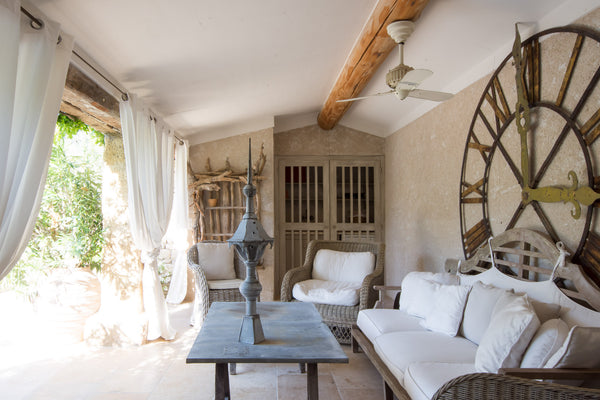 Salvaged lightning rod and antique clock face outdoor living room