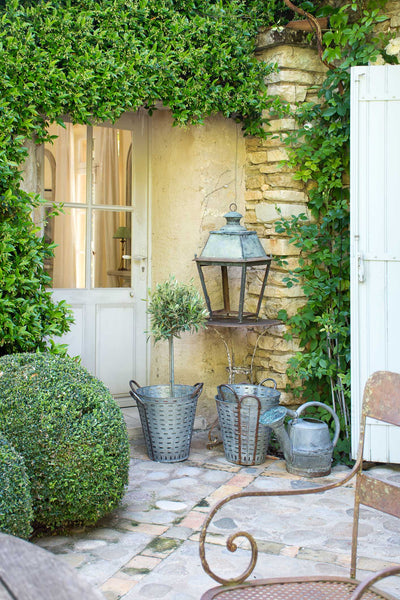 Rustic French lantern, zinc harvest buckets, antique watering can