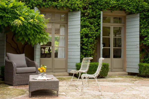 Outdoor entertaining French garden design Arras chairs climbing jasmine & wisteria