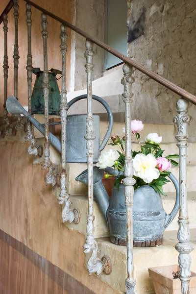 collection of antique french watering cans