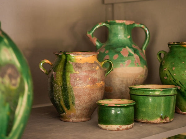 Collection of antique pottery with green glaze