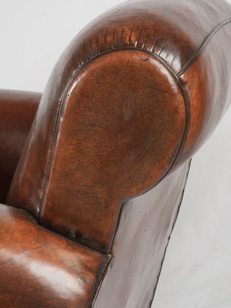 Scroll back gang box antique French leather club chair