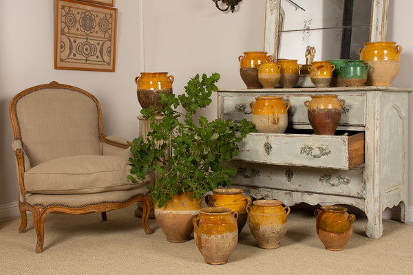 Collection of yellow ocher and green glazed French confit pots