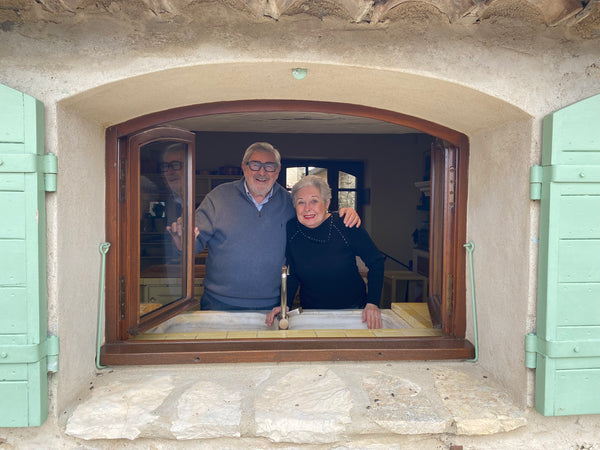 Patricia Wells & Walter Wells in the kitchen window at Chanteduc in Provence