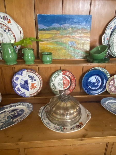 Kitchen dresser with antique pottery and art