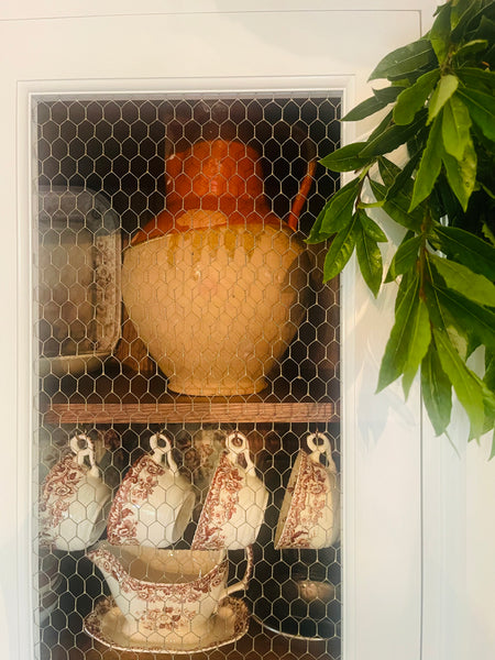 Antique French pitcher in kitchen dresser