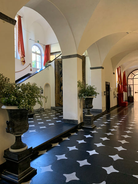 The Emperor's gallery La Cervara Slate and marble floor with antique busts and Medici urns