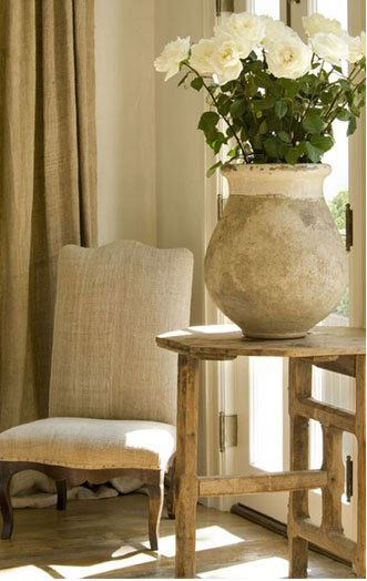 Cosy chair to read in the sun, biot jar and French vigneron table