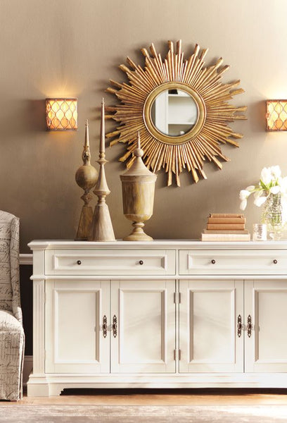 Sunburst mirror above buffet in entryway and living room gold frame
