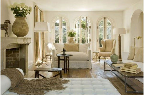 Pam Pierce living room with French style decor - biot jars and rustic antiques