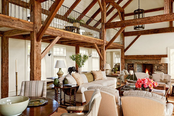Living room with exposed timber beams and vintage finds by Mark Cunningham