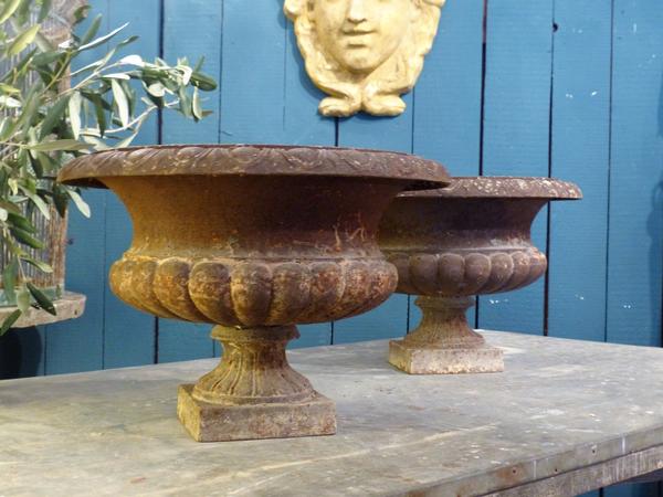 19th century cast iron medici urns pair rustic weathered