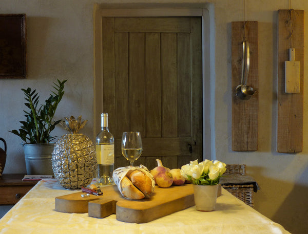 Vintage pineapple ice bucket in kitchen with chunky cutting board