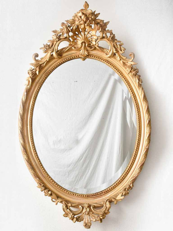 Louis XVI style oval mirror with large bow pediment 20¾ x 28¾