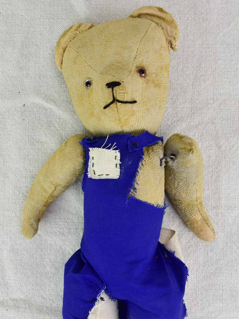 teddy bear with overalls