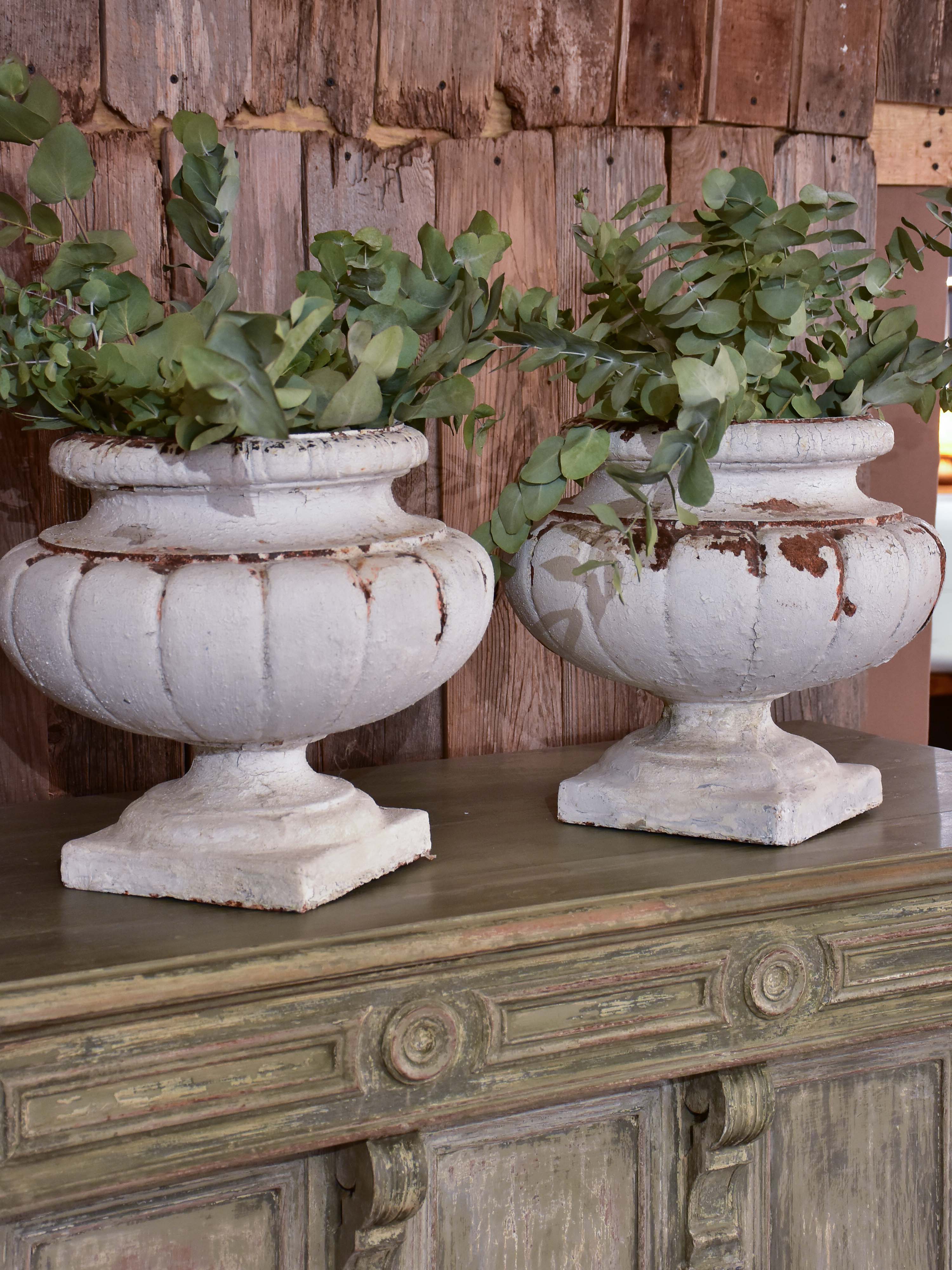 Two vintage French garden urns with white patina