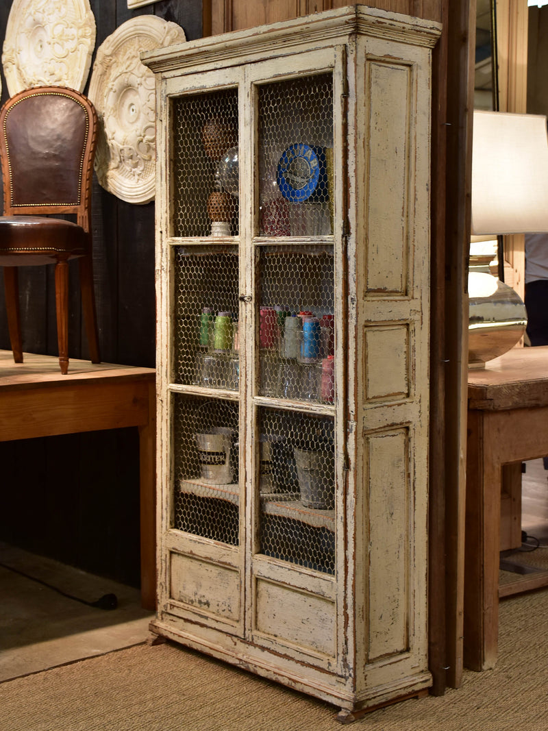 Rustic French armoire with grillwork doors