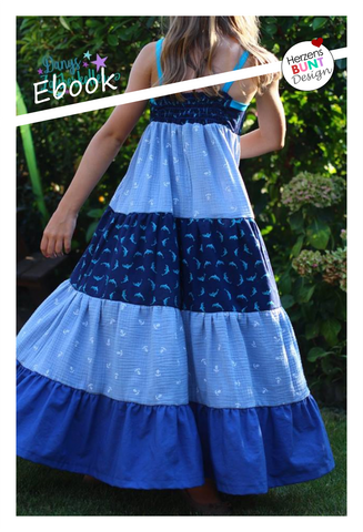 "Vergissmeinnicht" von Herzensbunt Design ist einfach das perfekte Sommerkleid für alle Gelegenheiten - ob luftig aus Musselin, als rockiges Top, als Jeanskleidchen für den Kindergarten oder mit Rüschen für den perfekten Prinzessinnenauftritt, bodenlang zum Schulanfang oder knielang zum Toben: 13 verschiedene Schnittvarianten in den Größen 74-146 beinhaltet dieses Ebook.  *Top mit oder oder Kontraststreifen, mit oder ohne Rückeneinsatz  *knielanges Kleid mit oder ohne Kontraststreifen, mit oder ohne Rückeneinsatz  *Maxikleid mit oder ohne Kontraststreifen, mit oder ohne Rückeneinsatz *Kleid mit Doppelstufe