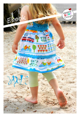 "Vergissmeinnicht" von Herzensbunt Design ist einfach das perfekte Sommerkleid für alle Gelegenheiten - ob luftig aus Musselin, als rockiges Top, als Jeanskleidchen für den Kindergarten oder mit Rüschen für den perfekten Prinzessinnenauftritt, bodenlang zum Schulanfang oder knielang zum Toben: 13 verschiedene Schnittvarianten in den Größen 74-146 beinhaltet dieses Ebook.  *Top mit oder oder Kontraststreifen, mit oder ohne Rückeneinsatz  *knielanges Kleid mit oder ohne Kontraststreifen, mit oder ohne Rückeneinsatz  *Maxikleid mit oder ohne Kontraststreifen, mit oder ohne Rückeneinsatz *Kleid mit Doppelstufe