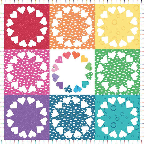 a rainbow coloured patchwork quilt with hearts arranged in circles