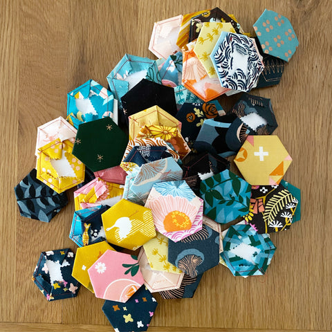 fabric basted over hexagons for EPP