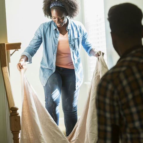 img of people using a drop cloth