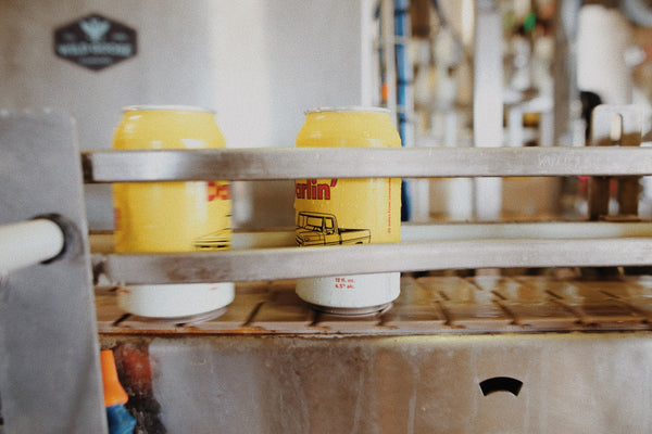 yellow and red canned beer