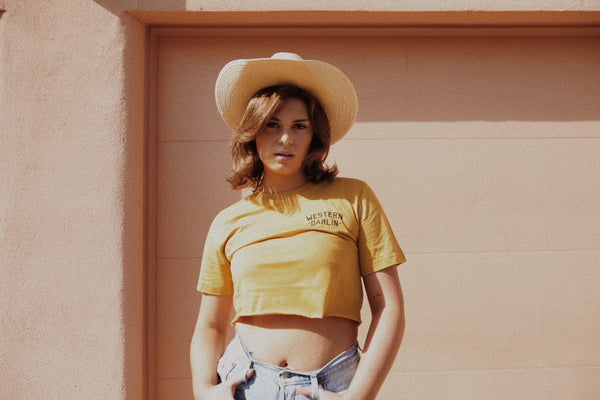 girl in yellow tee with cowboy hat