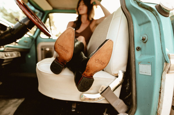 woman in truck with boots