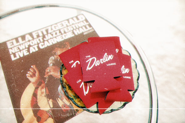 red koozies on table