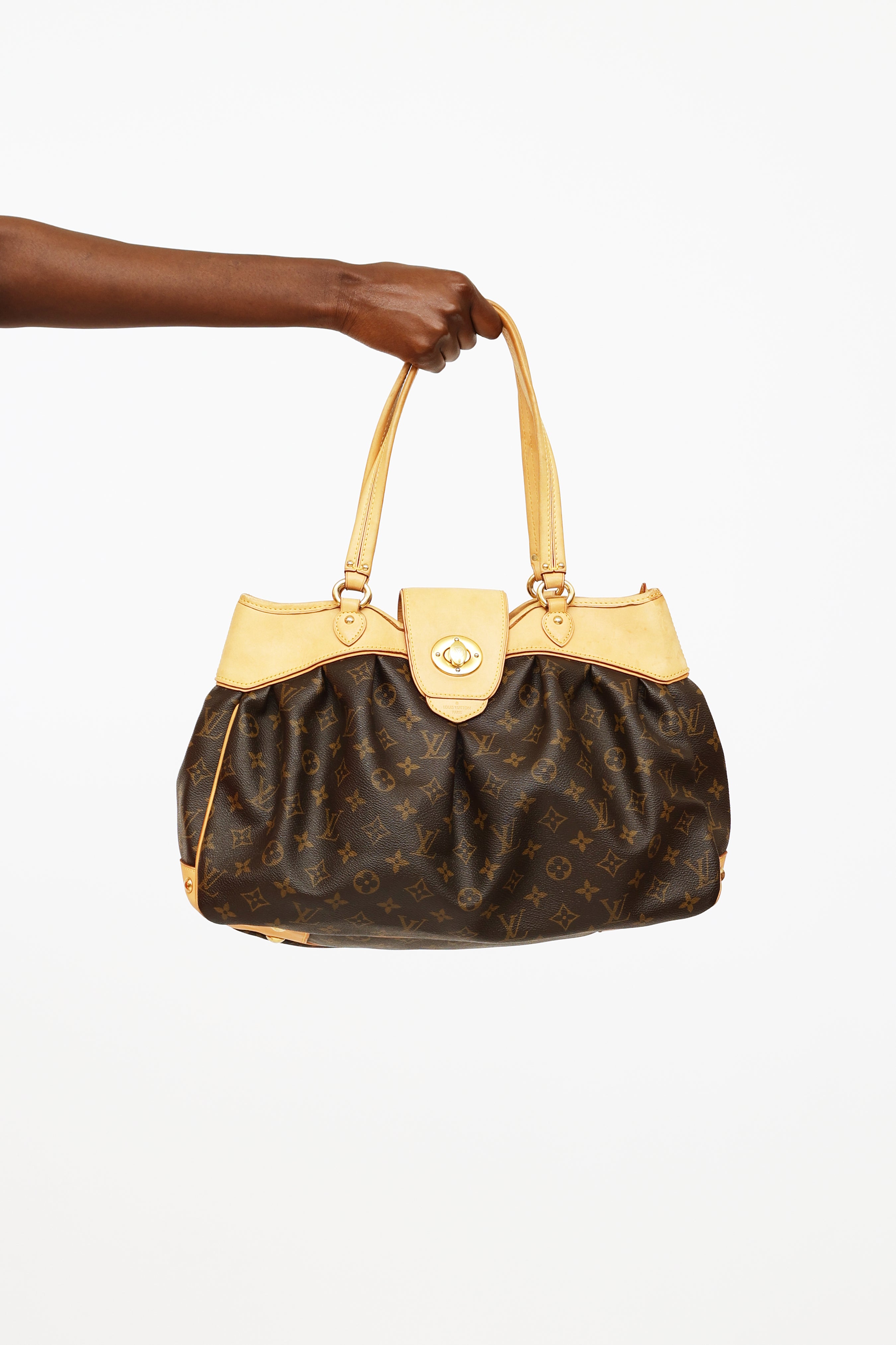 Discover Timeless Elegance: Louis Vuitton Artsy mm at Dress Raleigh