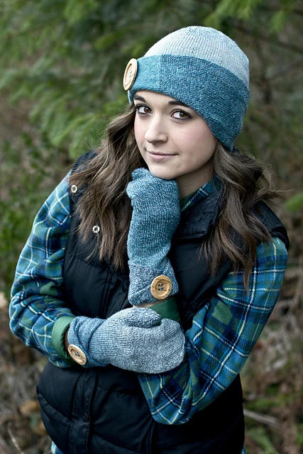 The Heritage Wave Sock Hat & Mittens set on a smiling model