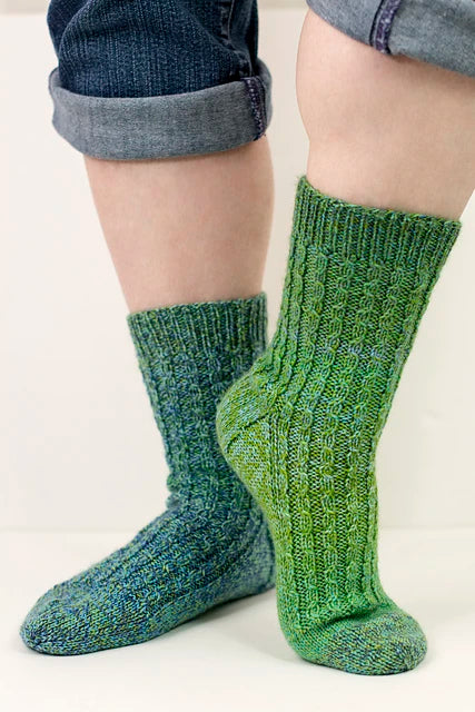 The Heritage Shannon Socks knit out of Cascade Heritage Wave Fingering