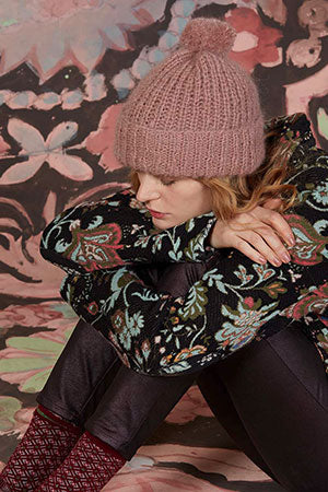 The Be Kind Hat, a cozy cap with a pom pom shown in the color 1084.0009