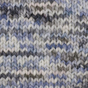 Coco in the color Shore 4906, a speckled colorway in with shades of white, grey, and blue.